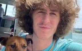 Jordan has brown bushy hair, is of a thin build and around 175cm tall.