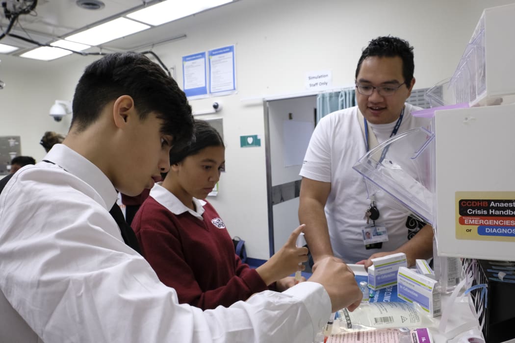 Jared Smiler, a 5th year medicine student at Otago University working with student.