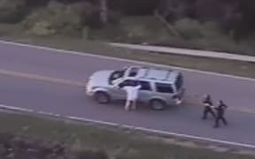 A screengrab from a video released by Tulsa police that showed the fatal shooting of Terence Crutcher as he stood next to his broken-down car.