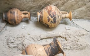 Small ancient greek lekythos decorated with groups of concentric