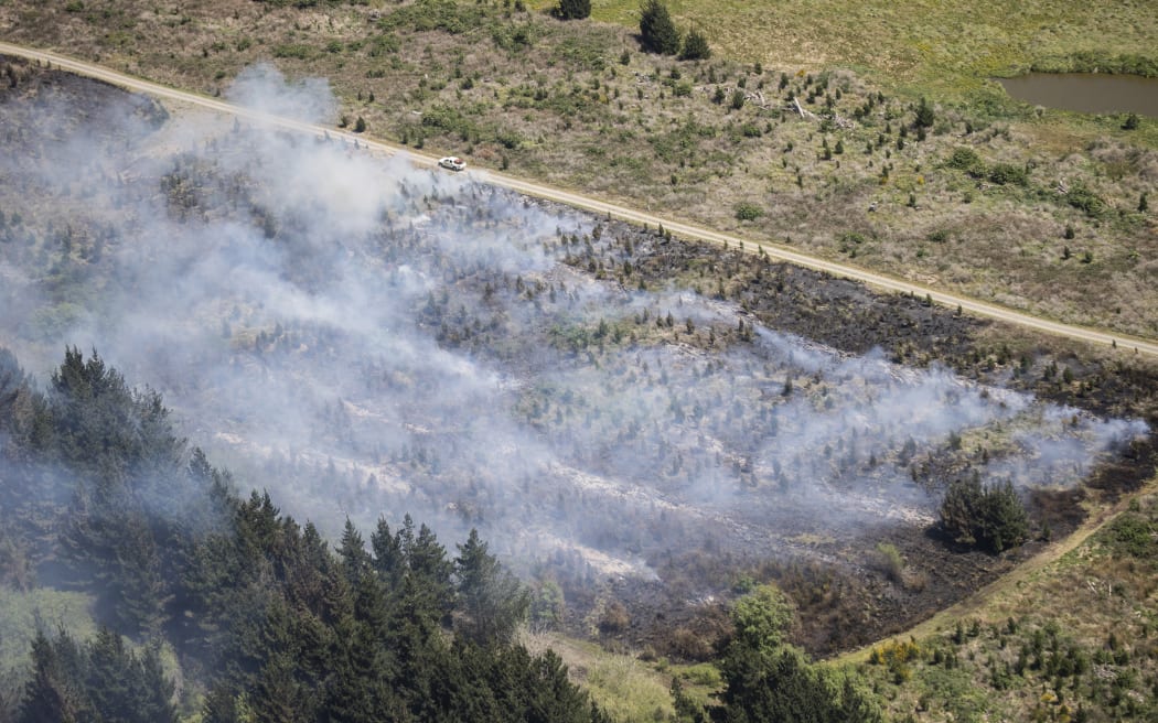 Canterbury fire crews have been battling a large scrub fire at Woodend beach. Helicopters and Planes got brought in to help fight the fire. 03 November 2022 New Zealand Herald Photograph by George Heard