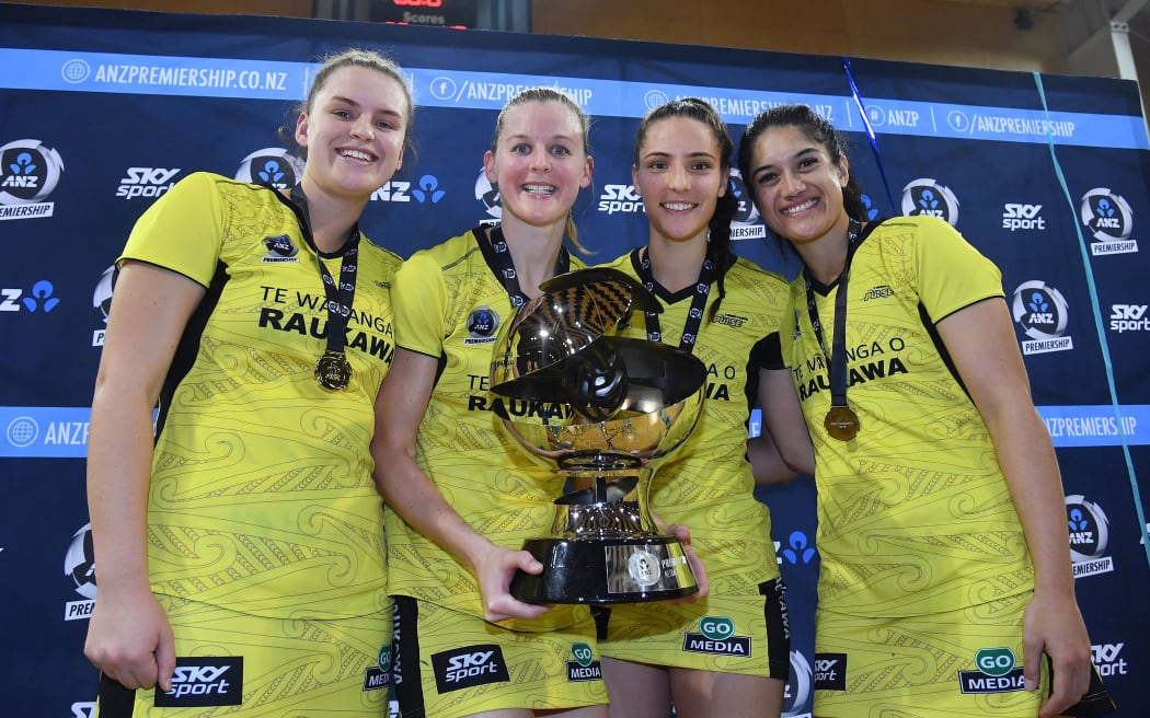 Pulse's Elle Temu, captain Katrina Rore, Karin Burger and Sulu Fitzpatrick hold the ANZ Premiership Trophy 2019.