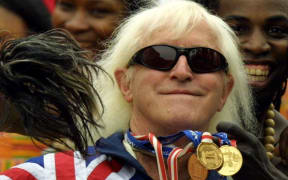 Jimmy Saville at the Queen's Golden Jubilee in June 2002, Buckingham Palace forecourt.