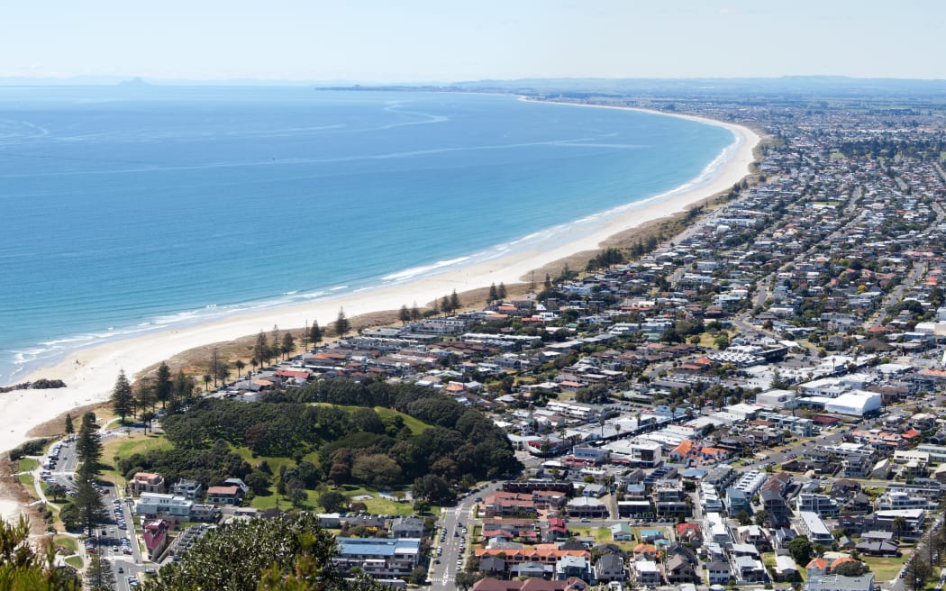 The panoramic view of Maunt Maunganui resort town from the top of Mount Maunganui volcano (Tauranga, New Zealand).