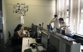 bFM volunteers at work in the station's newsroom.