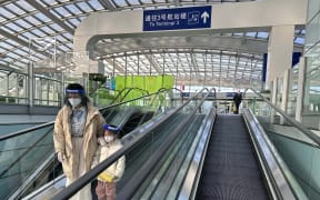 Few passengers are seen at Beijing Capital International Airport in China on Dec. 27, 2022. The Chinese government will drop Covid-19 quarantine requirements for international travelers arriving from abroad from January 8th. next year.  ( The Yomiuri Shimbun ) (Photo by Ichiro Ohara / Yomiuri / The Yomiuri Shimbun via AFP)