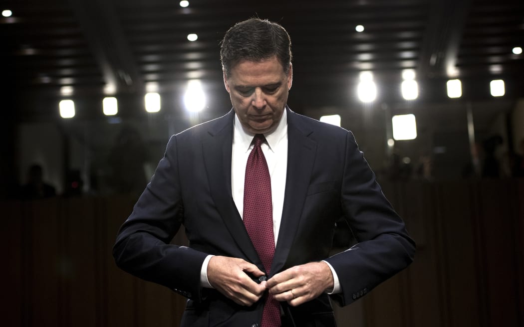 In this file photo taken on June 08, 2017 Ousted FBI director James Comey listens during a hearing before the Senate Select Committee on Intelligence on Capitol Hill June 8, 2017 in Washington, DC.