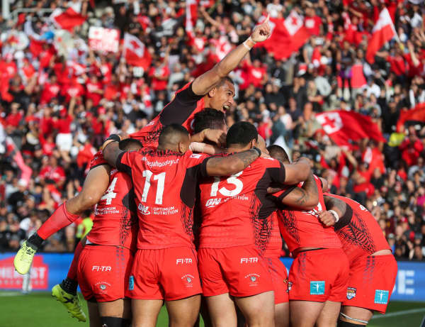 Tonga celebrate a try.