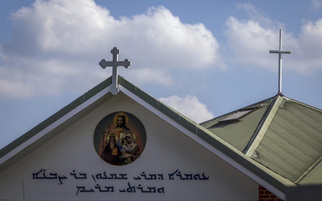 Crosses adorn the roof of the Christ the Good Shepherd Church in Sydney's western suburb of Wakeley on April 16, 2024. Australian police on April 16 said a brutal knife attack during a live-streamed church service was a religiously motivated "terrorist" act, as they urged calm from the angered local community. (Photo by DAVID GRAY / AFP)