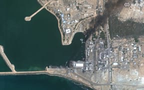 This handout satellite image courtesy of Vantor taken and released on March 1, 2026 shows destroyed and sinking vessels and damaged buildings at Konarak Naval Base in southern Iran along the Gulf of Oman. The United States and Israel launched strikes against Iran on February 28, killing Iran's supreme leader and top military leaders, prompting authorities to retaliate with strikes on Israel and US bases across the Gulf. (Photo by Satellite image ©2026 Vantor / AFP) / RESTRICTED TO EDITORIAL USE - MANDATORY CREDIT "AFP PHOTO / SATELLITE IMAGE Ã‚Â©2026 VANTOR" - HANDOUT - NO MARKETING NO ADVERTISING CAMPAIGNS - DISTRIBUTED AS A SERVICE TO CLIENTS - THE WATERMARK MAY NOT BE REMOVED/CROPPED