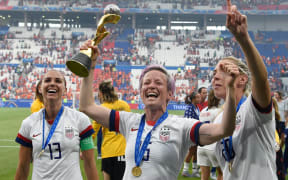 USA's players including Megan Rapinoe , centre, celebrate their World Cup title win.