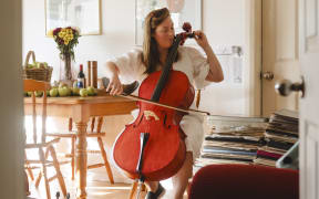 Farmer Caitlin Morris has been playing cello since she was 15 years old.