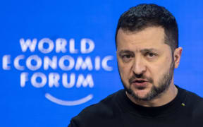Ukrainian President Volodymyr Zelensky addresses the assembly at the World Economic Forum annual meeting in Davos, on January 16, 2024. (Photo by Fabrice COFFRINI / AFP)