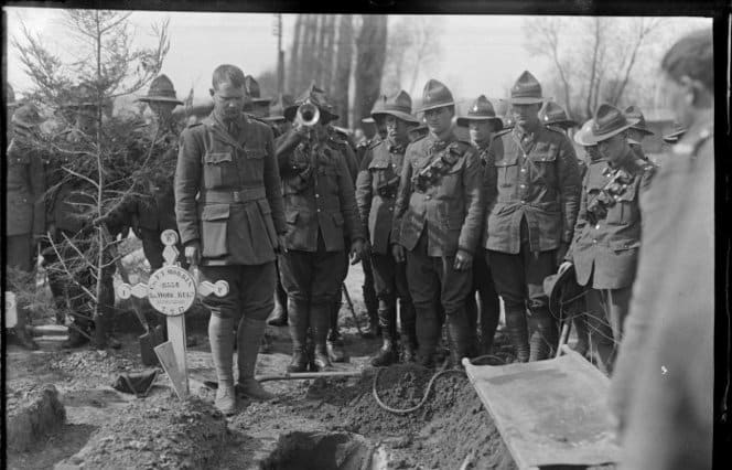 Last Post being played at the burial of Sapper J F Haynes, Romarin, France.