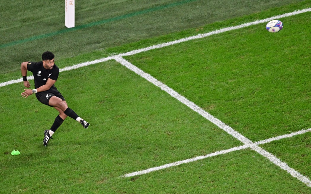 New Zealand's fly-half Richie Mo'unga kicks the ball but fails to convert a try during the France 2023 Rugby World Cup final match between New Zealand and South Africa at the Stade de France in Saint-Denis on 28 October, 2023.