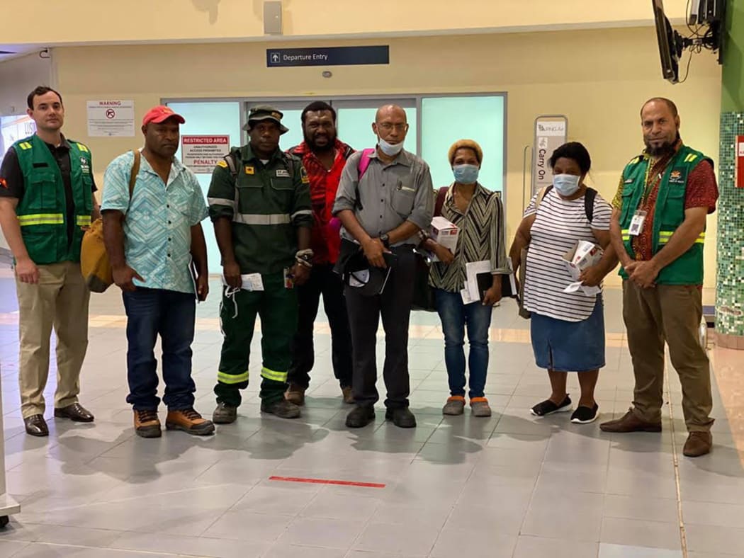 A team with personnel from Papua New Guinea's Department of Health, St John's Ambulance and other agencies, with support from the WHO and UNICEF, flew to East New Britain, 7 April 2020, following confirmation of a covid--19 case in Kokopo.
