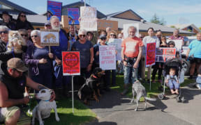 More than 40 people and at least a dozen pooches took part in the protest