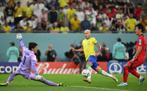 Brazil's forward Richarlison takes a shot during the Qatar 2022 World Cup round of 16 football match between Brazil and South Korea at Stadium 974 in Doha on 6 December, 2022.