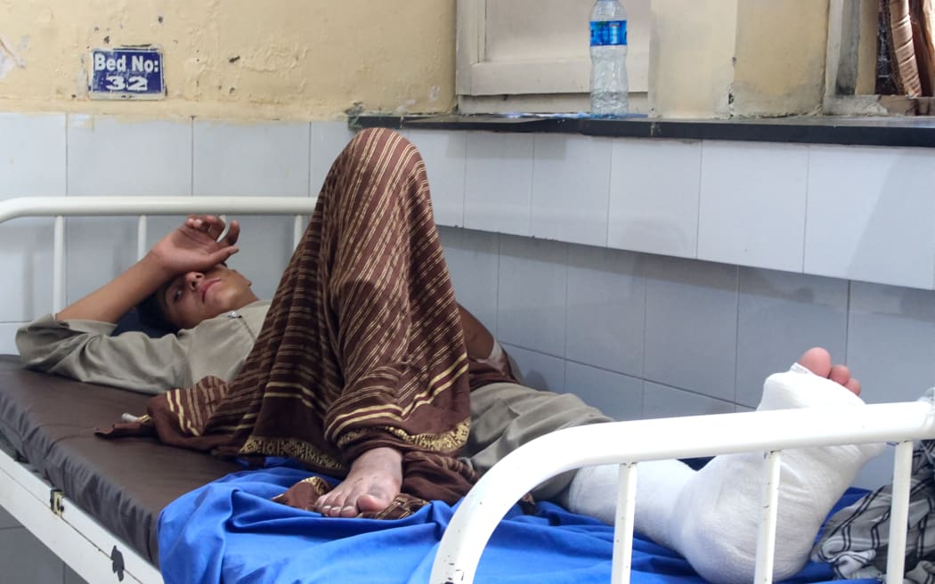 An injured Afghan man receives treatment at a hospital after an earthquake in Afghanistan's Jalalabad on September 1, 2025. Nine people died when a 6.0-magnitude earthquake and powerful aftershock rattled eastern Afghanistan, the provincial Nangarhar government said on September 1. (Photo by Aimal ZAHIR / AFP)