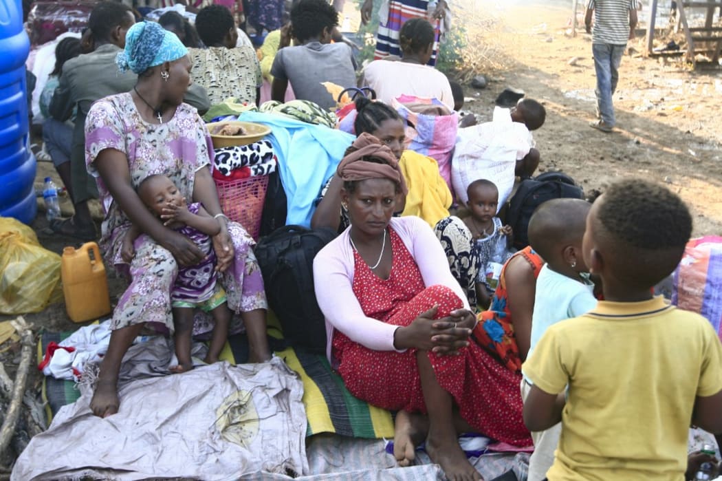 Ethiopian refugees who fled intense fighting in their homeland of Tigray, gather at the border reception centre of Hamdiyet, in the eastern Sudanese state of Kasala, on November 14, 2020.