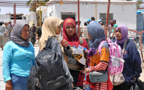 Indonesian jihadi brides arrive at a camp, after fleeing the Islamic State in Syria, in 2017.