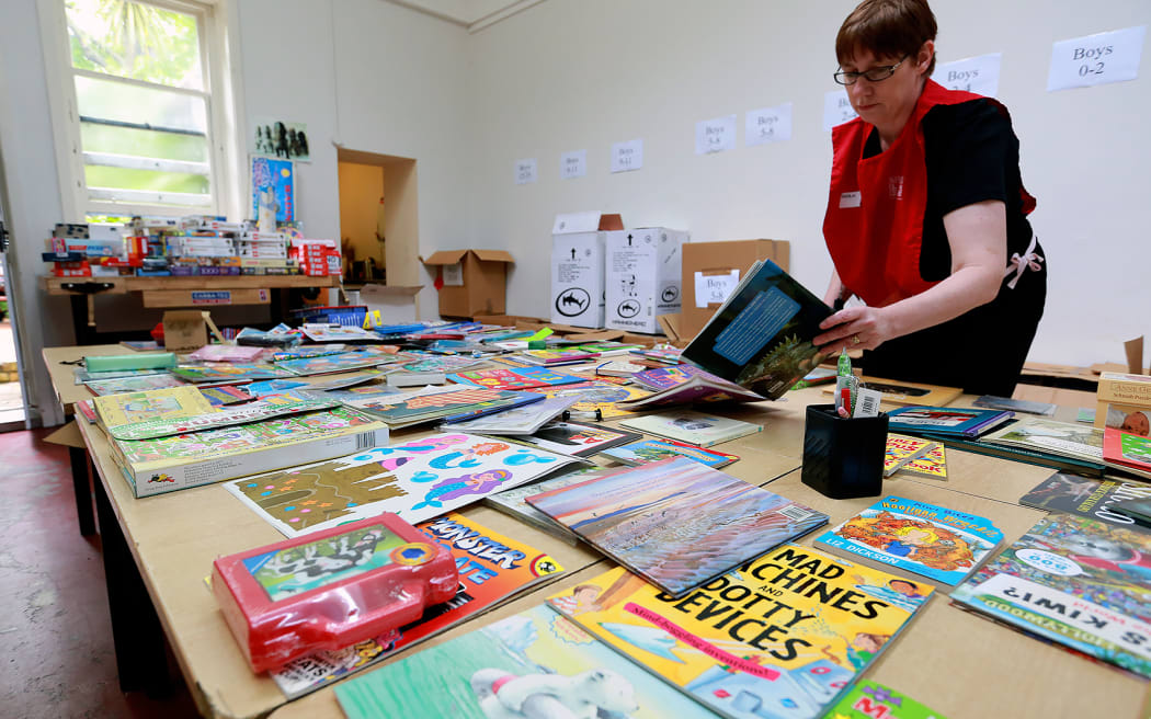 Volunteers sort out the donated goods for this year's Christmas parcels at the Auckland City Mission