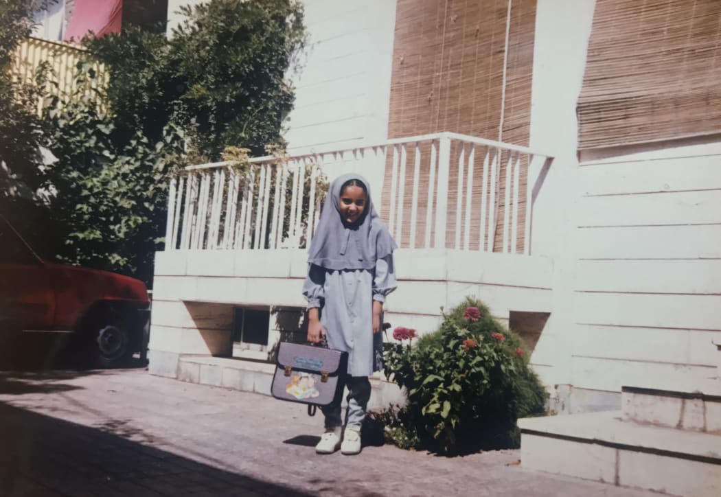 Golriz in school uniform, age 9.