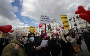: A group of people gather to support the law drafted at the initiative of the left coalition government and legalised the euthanasia in Madrid, Spain on March 18, 2021.