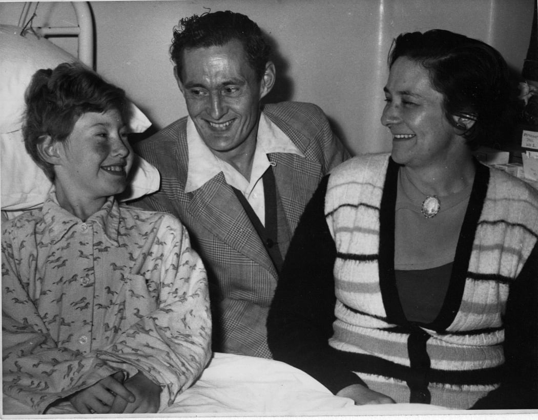 Helen Arnold post-operation with her parents