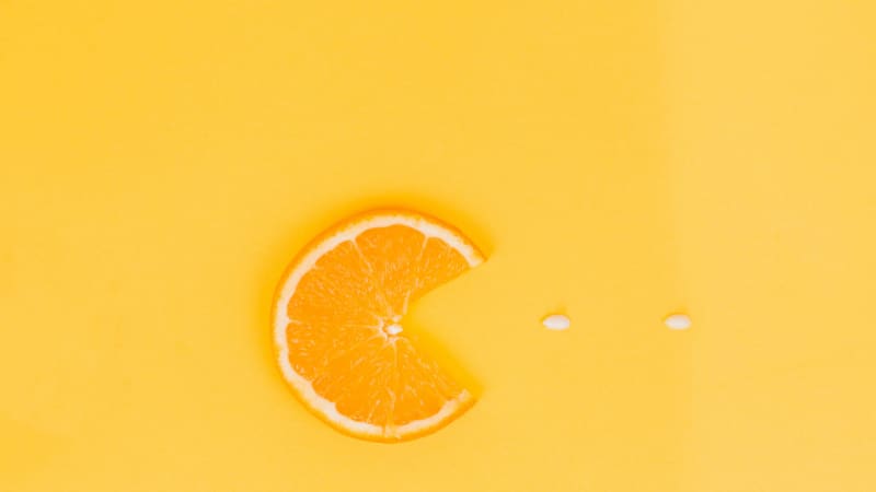 Orange slice gobbling up some vitamin C, Pac-Man style