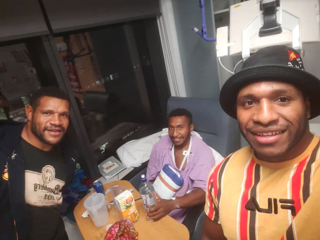 PNG Hunters teammates Dilbert Isaac (L) and Edwin Ipape (R) were constants during Jokadi Bire’s stay in hospital.