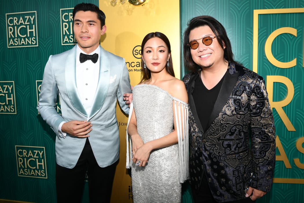 Actor Henry Golding, actress Constance Wu, and Kevin Kwan arrive at Warner Bros. Pictures' 'Crazy Rich Asians' Premiere at Warner Bros.