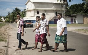 Young men walking in Mata'utu, the biggest town in Wallis and Futuna.