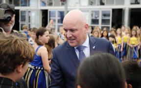 Christopher Luxon talks to pupils at a school visit in Auckland, shortly after the 2023 election.