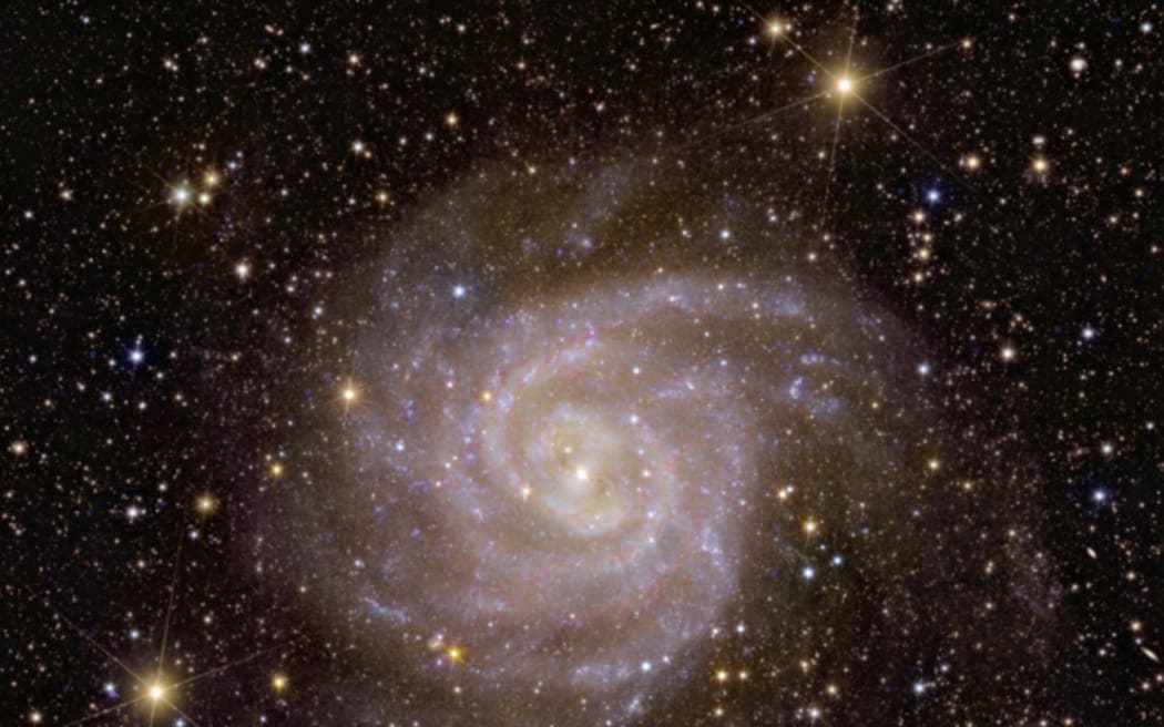 Spiral galaxy IC 342 (The "Hidden Galaxy") is difficult to see because it's located on the far side of the Milky Way.