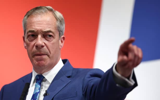 Nigel Farage, honorary chairman of Britain's right-wing populist Reform UK party and new leader, responds to reporters during a campaign meeting, June 3, 2024, ahead of Britain's July 4 general election.