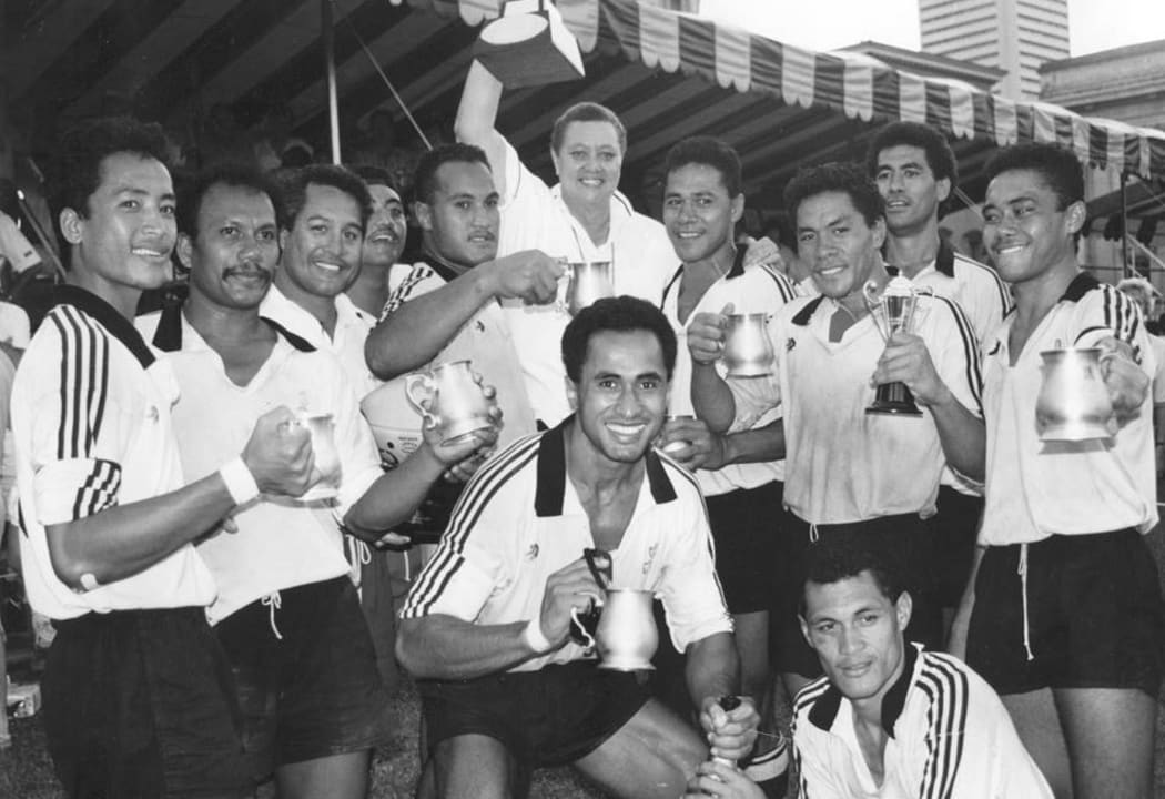 Manager Marina Schaafhausen holds winning Cup as Moata'a celebrate victory at Singapore Sevens.