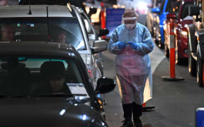 A medic at a drive-through Covid-19 testing site in a Melbourne shopping centre on 26 June, 2020.