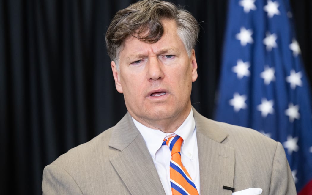 US Deputy Secretary of State Christopher Landau speaks to the press after welcoming the first group of Afrikaners from South Africa to arrive for resettlement, at Washington Dulles International Airport in Dulles, Virginia, on May 12, 2025. President Donald Trump on Monday defended the decision to resettle a group of white Afrikaners in the United States as refugees, saying they were fleeing a "terrible situation" in South Africa. Trump's remarks to reporters at the White House came just hours before an initial group of around 50 Afrikaners was set to arrive at an airport outside Washington. (Photo by SAUL LOEB / AFP)