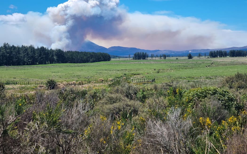 Smoke rises into the sky, as seen from Waimarino Village on Sunday.