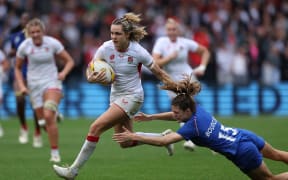 England fullback Ellie Kildunne makes a break against France.
