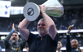(FILES) Tottenham Hotspur's Greek-Australian Head Coach Ange Postecoglou holds aloft the Europa League trophy, following their mid-week win in the Europa League Final on May 21, as he and the team display it for fans following the English Premier League football match between Tottenham Hotspur and Brighton and Hove Albion at the Tottenham Hotspur Stadium in London, on May 25, 2025. Tottenham Hotspur sacked manager Ange Postecoglou on June 6, just two weeks after the Australian won the Europa League to end the club's 17-year trophy drought. (Photo by JUSTIN TALLIS / AFP) / RESTRICTED TO EDITORIAL USE. NO USE WITH UNAUTHORIZED AUDIO, VIDEO, DATA, FIXTURE LISTS, CLUB/LEAGUE LOGOS OR 'LIVE' SERVICES. ONLINE IN-MATCH USE LIMITED TO 120 IMAGES. AN ADDITIONAL 40 IMAGES MAY BE USED IN EXTRA TIME. NO VIDEO EMULATION. SOCIAL MEDIA IN-MATCH USE LIMITED TO 120 IMAGES. AN ADDITIONAL 40 IMAGES MAY BE USED IN EXTRA TIME. NO USE IN BETTING PUBLICATIONS, GAMES OR SINGLE CLUB/LEAGUE/PLAYER PUBLICATIONS. /