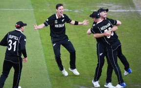 Matt Henry celebrates the dismissal of Karthik and Neesham's catch during the Black Caps semifinal win over India at Old Trafford.