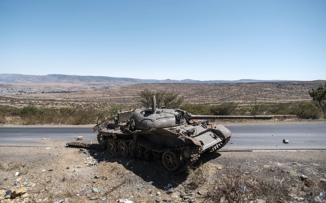 A damaged tank stands on a road north of Mekele, the capital of Tigray. - Ethiopian authorities on August 24, 2022 accused Tigray rebels of launching a new offensive against federal forces in the country's north, five months after a truce paused the worst of the fighting.
"Disregarding the numerous peace options presented by the Ethiopian government, the armed wing of the terror group TPLF (Tigray People's Liberation Front), pushing with its recent provocations starting 5 am (0200 GMT) today committed an attack" in a region around southern Tigray, the Government Communication Service said in a statement. (Photo by EDUARDO SOTERAS / AFP)