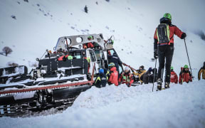 Rescuers work at the crash site in the mountains, near the ski resort of Campo Felice, central Italy.