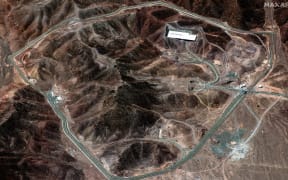 (FILES) This handout satellite image provided by Maxar Technologies shows the Fordow Fuel Enrichment Plant in central Iran on June 14, 2025. President Donald Trump said June 21, 2025 the US military has carried out a "very successful attack" on three Iranian nuclear sites, including the underground uranium enrichment facility at Fordo. "We have completed our very successful attack on the three Nuclear sites in Iran, including Fordow, Natanz, and Esfahan," Trump said in a post on his Truth Social platform. He was set to address the nation at 10 pm (0200 GMT) after deciding to join Israel's strikes on Iran's nuclear program. (Photo by Satellite image ©2025 Maxar Technologies / AFP) / RESTRICTED TO EDITORIAL USE - MANDATORY CREDIT "AFP PHOTO / SATELLITE IMAGE ©2025 MAXAR TECHNOLOGIES " - NO MARKETING - NO ADVERTISING CAMPAIGNS - DISTRIBUTED AS A SERVICE TO CLIENTS - THE WATERMARK MAY NOT BE REMOVED/CROPPED / THE WATERMARK MAY NOT BE REMOVED/CROPPED