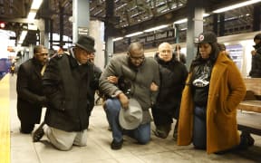 A general view shows the vigil of civil rights leaders, along with Rev. Kevin McCall, who presides over the vigil at the Stillwell Avenue subway station in Coney Island, New York, United States, on December 26, 2024. The religious leaders present at the vigil state that this should not happen and that the system fails them.

New York Police capture Guatemalan national Sebastian Zapeta-Calil for burning alive a woman not yet identified by authorities who is sleeping on the train. The victim and the suspect ride the F train just before 7:30 a.m. to the Stillwell Avenue subway station in Coney Island on December 22. The NYPD is on high alert due to the high level of violence on the train. (Photo by Deccio Serrano/NurPhoto) (Photo by DECCIO SERRANO / NurPhoto / NurPhoto via AFP)