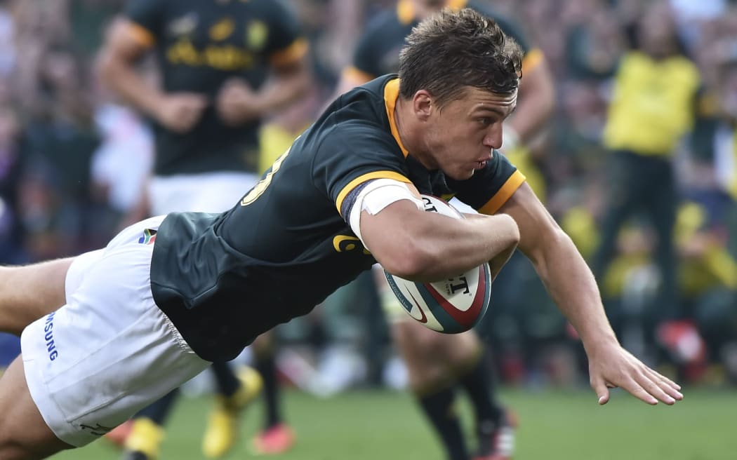 The Springboks Handre Pollard dives for a try.