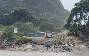 High swells and rain at Mt Maunganui Beach, 13 February.