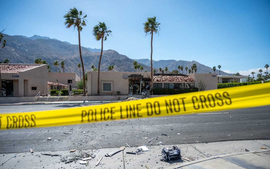A police line is seen outside a damaged American Reproductive Centers fertility clinic after a bomb blast outside the building in Palm Springs, California, on May 17, 2025. A bomb blast outside a California fertility clinic killed one person Saturday, in what the US attorney general called an "unforgivable" attack. The blast ripped through downtown Palm Springs, badly damaging the clinic and blowing out the windows and doors of other nearby buildings. (Photo by Gabriel Osorio / AFP)